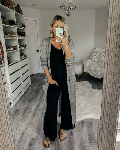 Romper With Cardigan Fall, Wide Leg Jumpsuit With Duster, Black Jumpsuit Sneakers Outfit, Rompers With Cardigans, Knit Jumpsuit Outfit, Oversized Jumpsuit Outfit Winter, Womens Duster Outfit, Jumpsuit With Sweater Outfit, Jumpsuit And Cardigan Outfits