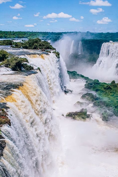 There's no doubt that Iguazu Falls is one of the most breathtaking sights in the world. It has even been named one of the New 7 Wonders of Nature. In this guide you'll find everything you need to know for visiting Iguazu Falls from the Brazilian side and planning a trip of a lifetime to these majestic waterfalls! Iguazu Cataratas | Iguazu Falls photography | Foz do Iguacu | Things to do in Iguazu Falls Brazil | South America bucket list | Brazil bucket list | Things to do in Brazil Iguacu Falls Brazil, Brazil Bucket List, Brazil Waterfalls, Things To Do In Brazil, America Bucket List, Iguassu Falls, Iguazu Waterfalls, Trip To Brazil, 7 Natural Wonders