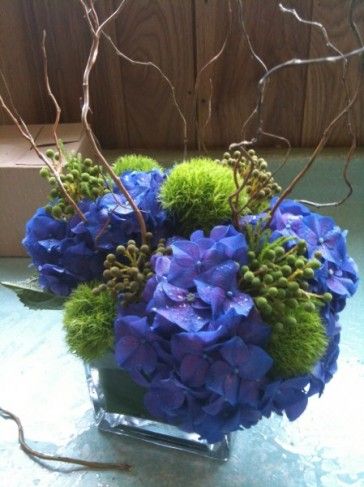 flowers Periwinkle Palette, Midnight Blue Flower Arrangement, Blue White Green Floral Centerpiece, Blue And Green Hydrangea Centerpiece, Green And Periwinkle, Blue Green Purple Flower Arrangements, November Flowers, Blue Purple Floral Arrangement, Hydrangea Centerpiece Wedding