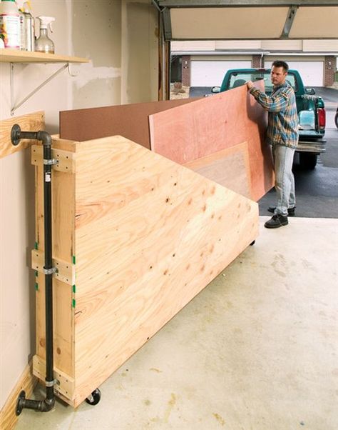 Swing-Out Plywood Storage I was looking for a way to keep my small inventory of plywood organized and easy to access. The garage at my town house is small, but I did have a narrow space along one of the sidewalls next to the overhead door. After some head scratching I designed this swing-out storage unit. It fits the space perfectly and allows me to access any piece of plywood … Diy Plywood Storage, Plywood Organizer, Plywood Storage Rack, Plywood Rack, Workshop Organisation, Officine In Garage, Woodshop Ideas, Organization Garage, Plywood Storage