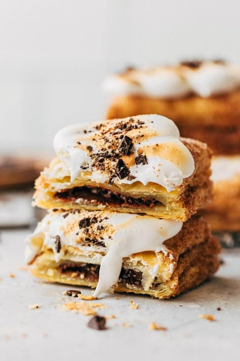 These homemade s'mores pop tarts are baked with flaky puff pastry, coated in graham cracker cinnamon sugar, and topped with a toasted marshmallow meringue. They're so easy to make and are a fun elevated version of classic s'more. #smores #poptarts #puffpastry #snickerdoodle #butternutbakery | butternutbakeryblog.com S’mores Snack, S'more Recipes, Smores Poptarts, Puff Pastry Pop Tarts, Tarts With Puff Pastry, Smores Pops, Marshmallow Meringue, Butternut Bakery, Tart Filling