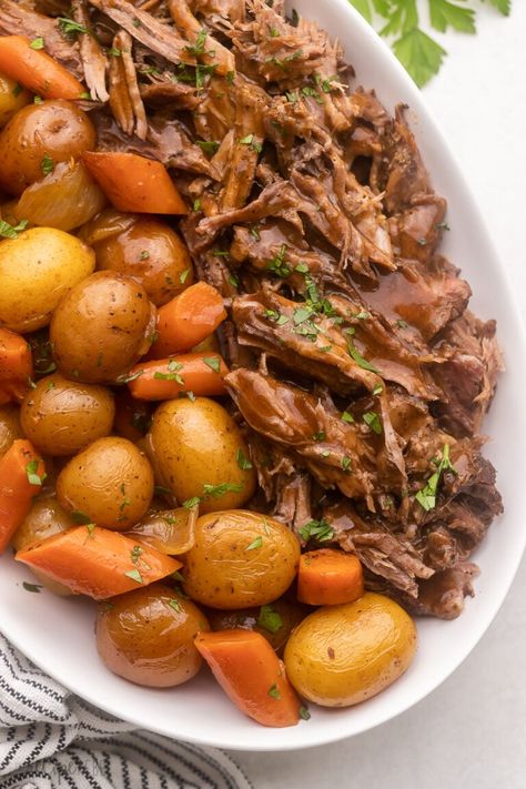 This easy oven Pot Roast recipe makes a truly delicious dinner centerpiece, perfect for the whole family for Sunday dinners or special occasions! With juicy beef seasoned in a homemade spice rub, it's cooked with potatoes and carrots until tender in a flavorful gravy made from scratch - it's the perfect pot roast! #dinner #recipe | pot roast recipe | beef roast | chuck roast | dinner ideas | dinner recipes | chuck roast recipes | sunday dinner | holiday dinner recipes Chuck Roast Recipe Oven, Roast Beef Recipes Oven, Pot Roast Gravy, Beef Gravy Recipe, Leftover Pot Roast, Perfect Pot Roast, Holiday Dinner Recipes, Roasted Potatoes And Carrots, Easy Pot Roast