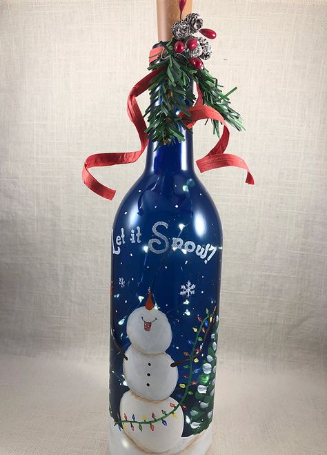 Christmas Wine Bottle Crafts Diy, Snowman Bottle, Snowman Wine Bottle, Wine Bottle Crafts Christmas, Holiday Wine Bottles, Blue Wine Bottles, Wine Bottle Light, Hand Painted Wine Bottles, Cardinal Christmas