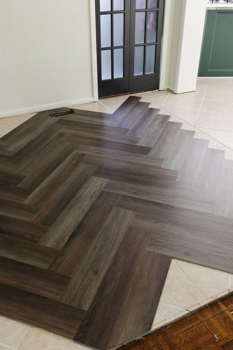 Wood Floors Next To Tile, Herringbone Sheet Vinyl Flooring, Luxury Vinyl Plank Flooring Herringbone Pattern, Chevron Vinyl Plank Flooring, Herringbone Luxury Vinyl Floor, Herringbone Lvp Flooring, Lvp Herringbone, Herringbone Vinyl Plank Flooring, Entryway Flooring Ideas