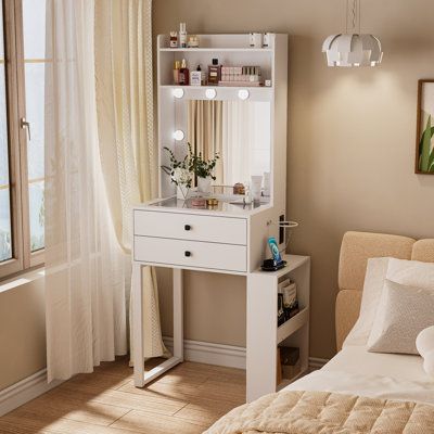 Meet your morning matchmaker: our compact vanity that turns tiny into mighty! Light up your look with 8 brilliant bulbs and say goodbye to clutter with savvy storage. Peek through a tempered glass top, charge up with built-in outlets, and breeze through setup. It's not just a vanity—it's a mini makeover miracle. Ready, set, glow! | Latitude Run® Compact Makeup Vanity Desk w/ Lighted Mirror And Charging Station Brown/White 59.8 x 26.2 x 15.7 in, Wood | C110533371 | Wayfair Canada Tiny Vanity Ideas, Mini Vanity Small Spaces, Mini Makeup Vanity, Tiny Vanity, Dream Beds, Corner Makeup Vanity, Mid Century Dressing Table, Makeup Vanity With Drawers, Dressing Table Modern