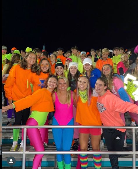 Rave Outfits For Football Game, 80s Student Section Theme, 80s Theme Football Game Outfit, Neon Night Football Theme, 80s Football Theme, Football Game Neon Theme, Super Hero Football Game Theme, Barbie Football Theme, Space Football Game Theme