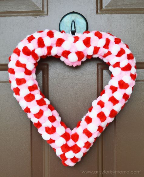 Easy Pom Pom Valentine Wreath Tutorial at artsyfartsymama.com #ValentinesDay Pom Pom Heart, Easy Pom Pom, Heart Shaped Wreath, Saint Valentin Diy, Diy Valentines Day Wreath, Valentines Bricolage, Fun Valentines Day Ideas, Diy Unicorn, Pom Pom Wreath