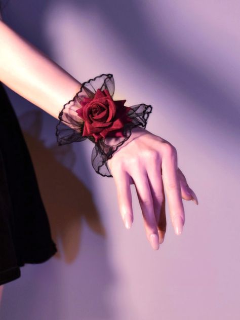 Add a touch of gothic glamour to your outfit with our exquisite lace rose wrist cuffs. These intricately designed wrist cuffs feature vintage-inspired lace and delicate rose embellishments, giving them a romantic and timeless appeal.   Please note that the product includes either one wrist cuff or a pair.  Option A: A wrist cuff.  Option B: A pair of wrist cuffs. Queen Of Hearts Outfit Inspiration, Wrist Cuffs Diy, Queen Of Hearts Aesthetic Outfits, Lace Wrist Cuffs, Rose Embellishments, Cuffs Diy, Gothic Glamour, Punk Accessories, Lace Bracelet