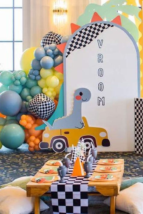 Check out this fun cars and dinos birthday party! The decor is fab! See more party ideas and share yours at CatchMyParty.com First Birthday Theme Boy, Birthday Party Paper Decorations, Bday Themes, Transportation Party, Dinosaur Birthday Party Decorations, Car Themed Parties, Dinosaur Themed Birthday Party, Car Birthday Theme, Main Table