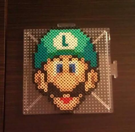 Luigi~ Perler Beads by CrimsonsCreations Perler Bead Luigi, Luigi Perler Bead Patterns, Nintendo Perler Beads, Luigi Perler Beads, Super Mario Perler Bead Patterns, Mario Perler Bead Patterns, Perler Beads Designs Pattern, Mario Perler Beads, Beads Quilt