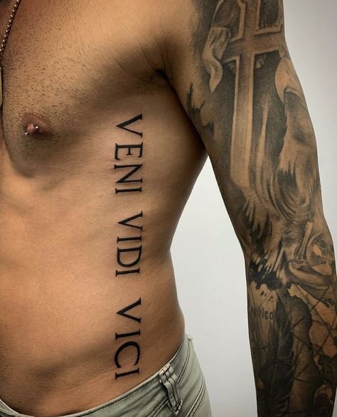 Side Rib Tattoo Men, Side Stomach Tattoos For Guys, Men’s Rib Tattoo, Oblique Tattoo, Veni Vidi Vici Tattoo, Word Tattoo Designs, Golden Spiral Tattoo, Latin Quote Tattoos, Ribs Tattoo