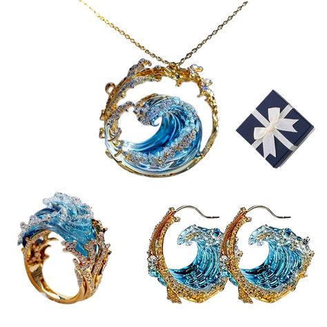 PRICES MAY VARY. 【Ocean's Oath Jewelry】Inspired by the ocean's waves, the Ocean's Oath Jewelry Set serves as a reminder of life's ups and downs. It encourages wearers to embrace their emotions and take their time to come back stronger, just like the waves. 【Exquisite Craftsmanship】 The Ocean's Oath Jewelry Set showcases exquisite craftsmanship with its distinct technique in crafting the blue wave section. This technique flawlessly captures the fluidity and transparency of seawater, giving the im Fine Jewelry Pendant Sets As Gifts, Fine Jewelry Pendant Set Gift, Blue Ocean-inspired Jewelry For Anniversary, Ocean-inspired Blue Jewelry For Anniversary, Costume Jewelry Sets With Matching Earrings For Gifts, Blue Jewelry For Birthday Gift And Mother's Day, Round Jewelry Sets For Mother's Day Gift, Ocean-inspired Sterling Silver Jewelry For Wedding, Ocean-inspired Sterling Silver Jewelry For Weddings