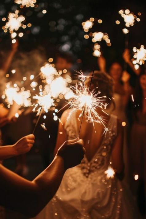 People holding sparklers at an evening celebration, with a person in a wedding dress in the center. Wedding Action Shots, Wedding Shots Alcohol, Wedding Photography Settings, Wedding Shots Photography, Details Shots Wedding, Detail Wedding Shots, Wedding Photography Shot List, Wedding Photography Detail Shots, Wedding Detail Shots