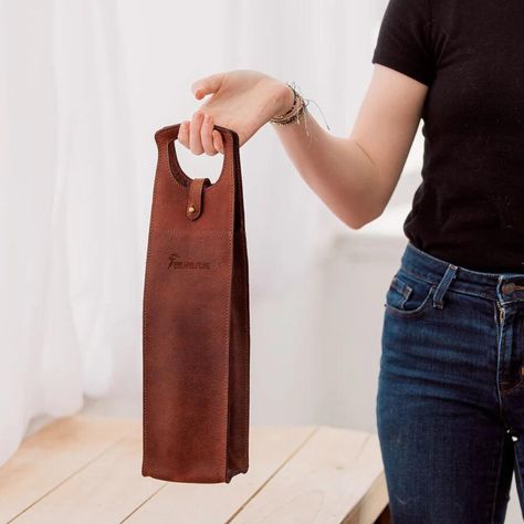 Whether you're heading to a dinner party or looking for the perfect gift, . Carry your favorite bottle in elegance or surprise a loved one with this timeless piece. ✨

Contact Us : +1 516 422-1111

👉 Swipe up to add a touch of class to your wine game!

#WineLover #LeatherGoods #WineAccessory #HandcraftedElegance #LuxuryGifts #WineNight #StylishTravel #GiftIdeas #LeatherLove #EtsyFinds #CraftedWithCare Leather Wine Carrier, Wine Games, Hunter Brown, Wine Carrier, Wine Night, Leather Artisan, Leather Art, The Hunter, Nice Leather