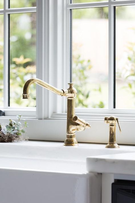 An antique brass vintage faucet is paired with a farmhouse sink and fixed in front of a window to a white marble countertop. White Kitchen Faucet, Vintage Kitchen Faucet, Kitchen Faucet Design, Farmhouse Bathroom Sink, Farmhouse Sink Faucet, Vintage Faucet, Valley House, Vintage Sink, Old Sink