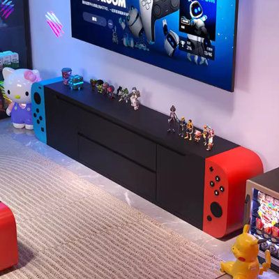 Inspired by gaming console aesthetics, this TV stand offers a serene palette that satisfies the soul. Fitted with cold-rolled steel rails for silent and smooth operation, its E1-grade eco-friendly material ensures safe and immediate use with strong storage capabilities. | jessica 78.74" W Storage Credenza, Steel in Blue;black;red | Wayfair Fun Game Room Decor, Gaming Dresser, Games Shelves, Video Game Living Room, Video Game Storage Ideas, Nintendo Switch Tv Frame, Game Console Wall, Game Controller Storage, Game Console Storage