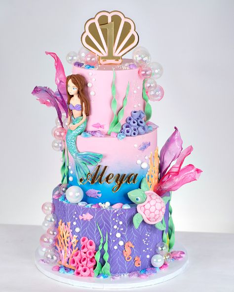 Dive into a world of wonder beneath the waves and prepare to be enchanted! 🌊✨ Our custom acrylic cake topper and name charm perfectly matched the intricate designs of this stunning and magical under-the-sea themed cake by @bluelacecakes 🎂 Her artistry brings mermaid, sea creatures and oceanic beauty to life 🧜‍♀️ 🐚🪸 This is truly a work of art in every detail! 👏 We can customize and brand acrylic pieces to match any event or birthday theme. DM us and let's collaborate! #acrylicsign #caketop... Under The Sea Birthday Cake Girl, Mermaid Theme Birthday Cake, Mermaid Cake Design, Mermaid Theme Cake, Under The Sea Cake, Little Mermaid Cakes, Mermaid Birthday Cakes, Cake Kids, Baby Birthday Decorations