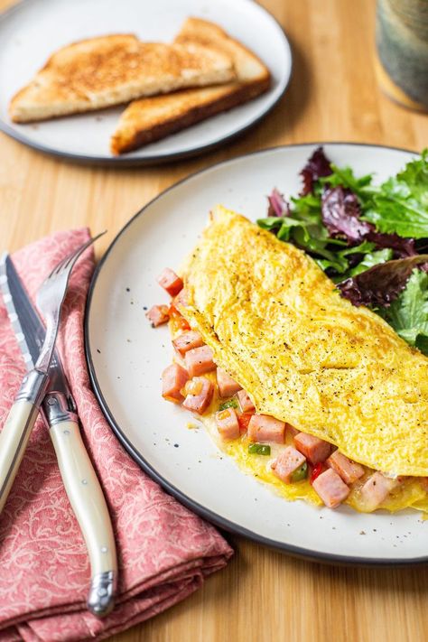 With plenty of ham, crisp-tender veggies, and a generous sprinkling of gooey Cheddar cheese, the classic Denver Omelet is proof that homemade omelets are way more approachable (and even more delicious) than you thought. Homemade Omelets, Denver Omelette Recipe, Denver Omelette, Fancy Cooking, Denver Omelet, Breakfast Sides, Omelets Recipe, Omelette Recipe, Egg Dish