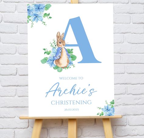 Personalised Blue Peter Rabbit Christening or Baptism welcome sign. Digital format - This will be emailed to you in PDF format. Please note no physical item will be received. Printed version -  These are printed onto high quality thick cardstock and are available in A4, A3 or A2. Please note - A2 signs do not stand alone on an easel due to their size and will require a foam board or to be placed in a frame. Please provide the following information when placing your order: Name Date Email address if purchasing a Digital copy. Please don't hesitate to get in touch with any questions you may have or to check progress of an order. Please note: The easel is for demonstration purposes only. POSTAGE: All prints are posted in hardback envelopes. UK POSTAGE: Free UK mainland delivery with Royal Mai Baptism Welcome Board, Peter Rabbit Christening, Christening Themes, Baptism Welcome Sign, Baptism Themes, Blue Peter, Girl Christening, Bunting Garland, Peter Rabbit