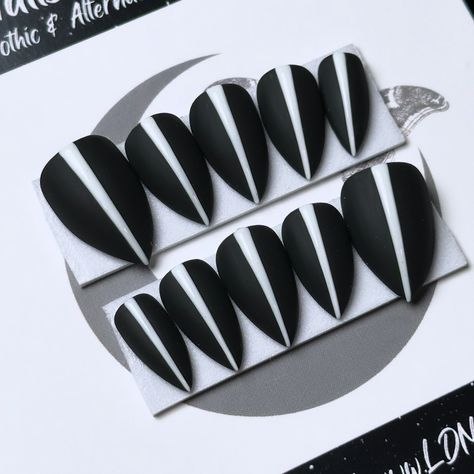 Sharp, Chic, and Spooky — these black and white Widows Peak Press Ons could be your new favorite accessory! 🖤💀🤍 WHITE WIDOW, Après X-Short Stiletto - Black as your soul base with glossy white detailing - Hitting the Shops TOMORROW 💅🏻🖤 ⁣ .⁣ .⁣ .⁣ .⁣ .⁣ #gothnails #gothicstyle #vampnails #mattenails #vampiregoth #spookynails #witchynails #vampirelife #witchyfashion #pressonnailset #witchnails #vampirenails #nailartist #blackandwhitenails #halloweennailart #gothaesthetic #gothicnails #halloween... Black Press On Nails, Vampire Nails, Short Stiletto, Witch Nails, White Widow, Country Nails, Widows Peak, Witchy Nails, Widow's Peak