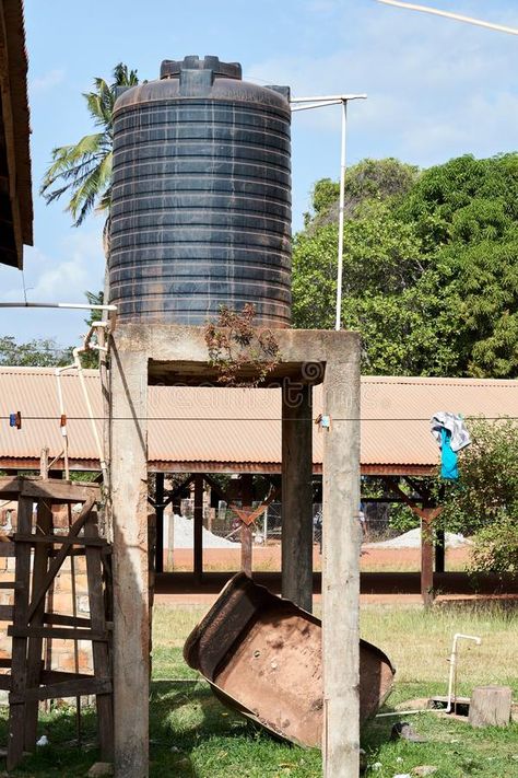 Photo about Residential Plastic Water Supply tank on elevated platform in Lethem, Guyana, South America. Image of homestead, architecture, construction - 140622484 Water Tank Stand Design, Homestead Architecture, Water Tank Stand, Awning Window, Rain Barrels, Bungalow Style House Plans, Tank Stand, Tank Pool, House Villa