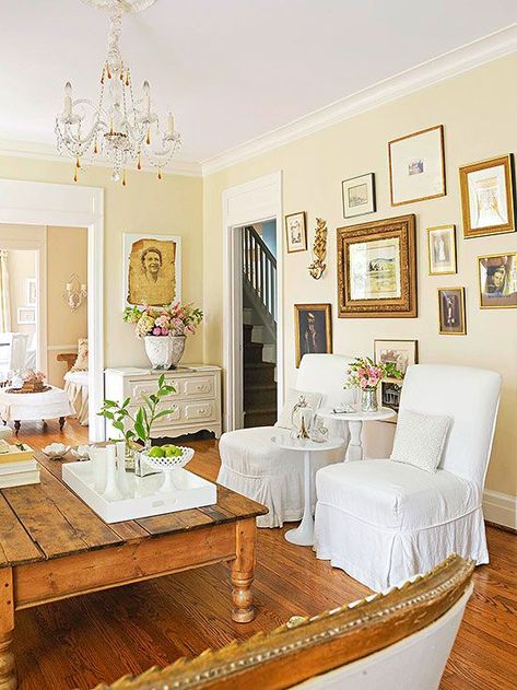 Antique Color Scheme  Tea-Stain + Gold + White. Love the wooden floors and antique gallery wall Pale Yellow Walls, Light Yellow Walls, Yellow Walls Living Room, White Slipcovers, Yellow Paint Colors, Yellow Room, Yellow Living Room, Gold Frames, Yellow Bedroom