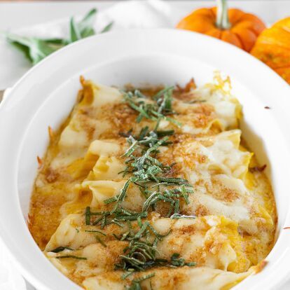 Indulge in a delicious and comforting Pumpkin Ricotta Manicotti with Roasted Garlic Brown Butter Sauce. This recipe features tender manicotti shells filled with a creamy mixture of ricotta, mascarpone, pumpkin puree, and mozzarella cheese, topped with a savory sauce of roasted garlic and brown butter. Perfect for fall and holiday dinners. Pumpkin Manicotti, Garlic Brown Butter Sauce, Brown Butter Sauce Recipe, Manicotti Shells, Pumpkin Ricotta, Cheese Manicotti, Manicotti Recipe, Brown Butter Sauce, Brown Rice Pasta