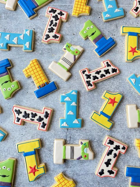 Toy Story First Birthday Cookies Toy Story Theme Cookies, Toy Story Sweets, Toy Story Cookies 1st Birthday, Two Infinity And Beyond Birthday Cookies, Toy Story Cookie Cake, Toy Story Themed Cake, First Birthday Toy Story Theme, Toy Story First Birthday Party Ideas, Toy Story Cookies Decorated