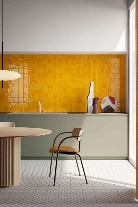 Yellow Vitra tiles line the wall of this colourful kitchen. Photo via Vitra #kitchen #kitchendesign #interiors #interiorstyle #colourfulinteriors #colourfulkitchen Yellow Kitchen Tiles, Yellow Wall Tiles, Mustard Kitchen, Wooden Dining Furniture, Casa Retro, Colourful Kitchen, Yellow Kitchen, Hus Inspiration, More Design