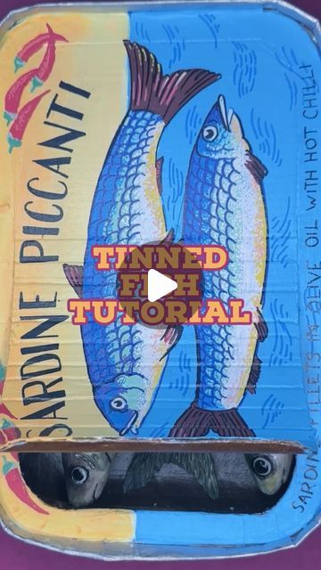 Kate Harnett on Instagram: "This is how I made my big tin of fish.   It still needs a pull tab but it’s possible that I will never make it because I have this horrible problem where I make things until they’re 99% complete and then I never finish them 💁  Video description: A variety of sped up clips showing some of the process of making a large polymer clay sardine. I start with an aluminum foil base and add polymer clay to it. I shape it and add texture. Then I use pastel dust with water to paint on some color. I paint the eyes black and cover with a clear water based polyurethane. Then I work on the “tin” which is already assembled. It’s made of painted cardboard and my hands are shown adding detail to the tin. There are two fish on the ocean and the text says “Sardine Piccanti” I turn Polymer Clay Aluminum Foil, Sardine Tin Art, Clay Sardines, Painted Cardboard, Summer Art Projects, Wild Art, Clay Wall Art, Two Fish, Eyes Black