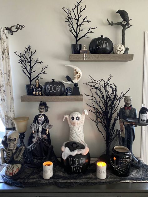 Bookshelves Halloween Decor, Halloween Countertop Decor, Halloween Vinyette, Halloween Decor For Shelves, Goth Halloween Decorations Indoor, Halloween Decorations Shelves, Halloween Coffee Table Decor Ideas, Halloween Entertainment Center Decor, Halloween Shelf Decor Ideas