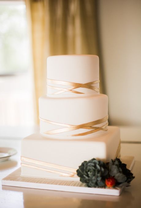 Brides.com: . A three-tiered, square and round wedding cake with geometric gold stripes, from Cakes by Gina. Wedding Cakes Simple, Golden Wedding Cake, Wedding Cake Simple Elegant, White And Gold Wedding Cake, Cakes Simple, Metallic Wedding Cakes, Round Wedding Cakes, Wedding Cakes Elegant, Square Wedding Cakes