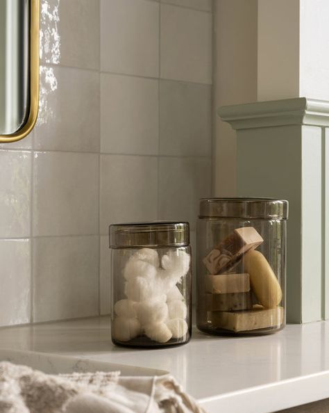 Glass Canisters Bathroom, Bathroom Canister Ideas, What To Put In Glass Jars, Canister Decor, Organic Modern Bathroom, Bathroom Canisters, Mcgee And Co, Bathroom Counter Decor, Counter Decor