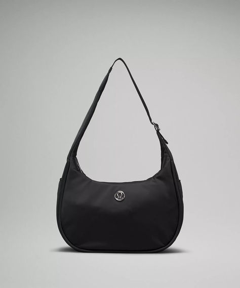 The lululemon mini shoulder bag is rarely in stock, but right now, you can scoop it up in *two* colors (black and green). Here's everything you need to know about the sporty chic purse, which has racked up more than 4 million views on TikTok. Chic Purses, Lululemon Bags, Envelope Purse, Mini Shoulder Bag, Sporty Chic, Day Bag, Back In Stock, Body Fit, Belt Bag