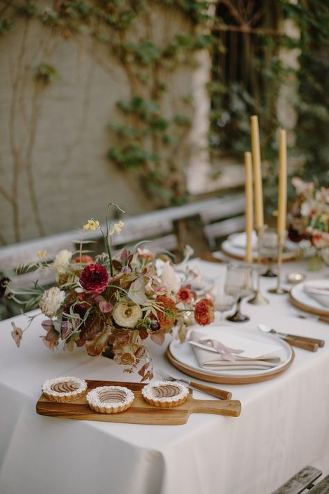 Hang on to your hats, because this earth toned wedding inspiration will have you spinning with ideas. Modern bridal fashion (dare we say… silk jumpsuit?), floral cuffs and a courtyard reception are just a few of the ingredients in this recipe for awesome sauce. And we know you will love every creative detail! #ruffledblog Courtyard Reception, Earth Tone Wedding, Courtyard Wedding, Earthy Wedding, Spring Tablescapes, Fall Florals, Silk Jumpsuit, Awesome Sauce, Fashion Goals