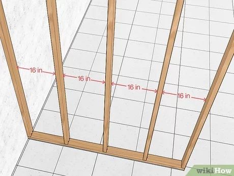 How to Build a Fake Wall: 12 Steps (with Pictures) - wikiHow Frame A Wall Diy, How To Frame Out A Wall, How To Build A Stud Wall Diy, Build A Partition Wall, Diy Wall To Separate Rooms, How To Build Interior Wall, Framing Walls How To Build, How To Build A False Wall, How To Put Up A Temporary Wall