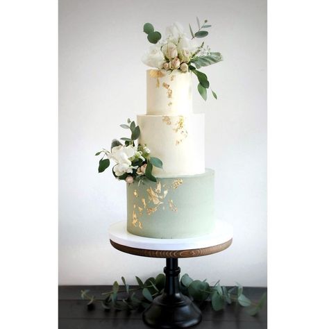 Sage green wedding cake. Buttercream finish with fresh flowers and gold leaf. Wedding Cakes Olive Green, Sage Green Wedding Cake 2 Tier, Sage Green And Gold Wedding Cake, Wedding Cake Sage Green, Cake With Gold Drip, Sage Green Wedding Cake, Wedding Cake Olive, Cake With White Flowers, Wedding Cake Gold Leaf