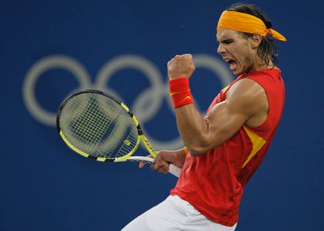 Today's Flashback Friday is dedicated in equal parts to Nike and Rafael Nadal's biceps, both of which made an otherwise not-so-flattering shirt style into a thing of beauty. The sleeveless shirt will forever be fondly enshrined in our memories of a younger Rafa. When Rafa first wowed us with his talent, he cut a remarkable… Rafael Nadal Fans, Nadal Tennis, Bicep Muscle, Tennis Legends, Beijing Olympics, Olympic Gold Medals, Andy Murray, Rafa Nadal, Rafael Nadal