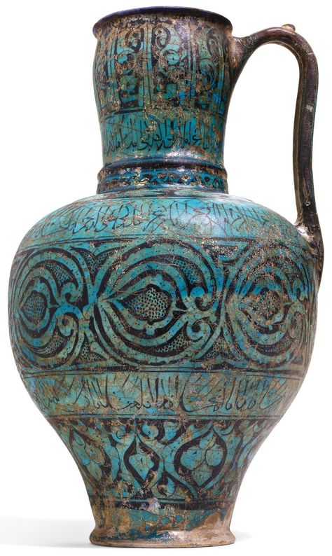 A RARE AND IMPORTANT KASHAN TURQUOISE GLAZED POTTERY PITCHER, PERSIA, CIRCA 1200-20 AD | Arts of the Islamic World & India including Fine Rugs & Carpets | Sotheby's Persian Pottery, Large Storage Jars, Turquoise Glaze, Celtic Dragon, Iranian Art, Glazed Pottery, Ad Art, Islamic World, Pottery Pitcher