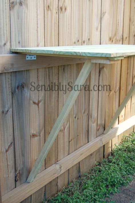 DIY Fence Table | SensiblySara.com Fence Table, Easy Backyard Diy, Diy Fence, Easy Backyard, Backyard Diy, Concrete Crafts, Potting Bench, Backyard Diy Projects, Backyard Fences