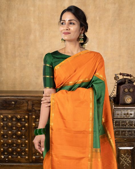 Featuring an exquisite Kanchipuram Silk Saree adorned with a striking combination of bottle green and orange. The saree showcases intricate pure zari checks on the body, complemented by a korvai orange border and ganga jamuna selvedge. Saree code: CL601244169 Indulge in an unparalleled shopping experience by visiting our esteemed store in Alwarpet, Chennai. You can also schedule a video call with us at +91 9962677777. Immerse yourself in a wide array of stunning collections or conveniently ... Kanchipuram Silk Saree, Video Call, Bottle Green, Chennai, Green And Orange, Silk Saree, A Video, Silk Sarees, Checks