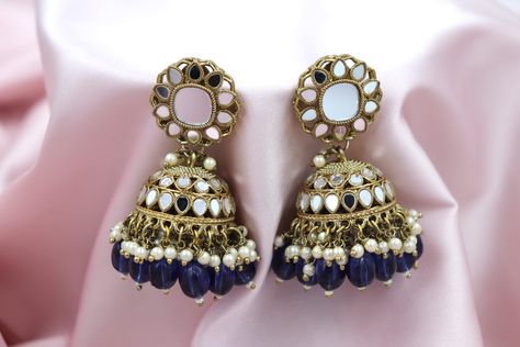 Elegant and unique, the Dark Purple Mirror Jhumka earrings blend traditional charm with contemporary allure. Dangling gracefully, these jhumka feature a rich, deep purple hue adorned with intricate mirror work. A fusion of vintage design and modern aesthetics, perfect for adding a touch of sophistication to any ensemble. Mirror Jhumka, Intricate Mirror, Purple Mirror, Jhumka Earrings, Mirror Work, Purple Hues, Modern Aesthetics, Boutique Shop, Dark Purple