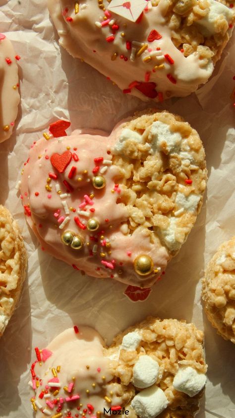 heart shaped rice krispie treats. rice krispie treats valentine's day. heart shaped desserts. valentine's themed food. heart shaped food. valentine's party food. heart shaped desserts aesthetic. heart shaped desserts easy. cute heart shaped desserts. heart shaped valentine's day treats. Heart Shaped Desserts, Shaped Rice Krispie Treats, Dipped Rice Krispie Treats, Chocolate Dipped Rice Krispie Treats, Valentines Party Food, Heart Shaped Food, Heart Shaped Chocolate, Valentines Day Treats, Rice Krispie Treats