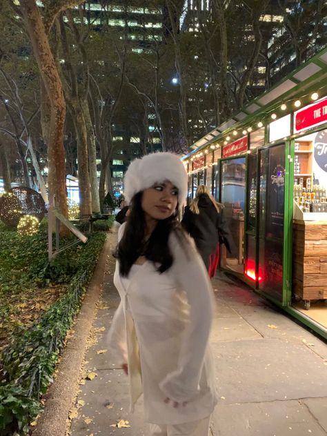 Bryant Park Winter Village Outfit, Winter White Fur Coat For Cold Weather, White Fluffy Winter Outfit, Winter White Fluffy Fur Coat For Winter, Bryant Park Nyc Winter, Snowy Nyc Aesthetic, Bryant Park Winter Village, New York Christmas Aesthetic, Trip Fits