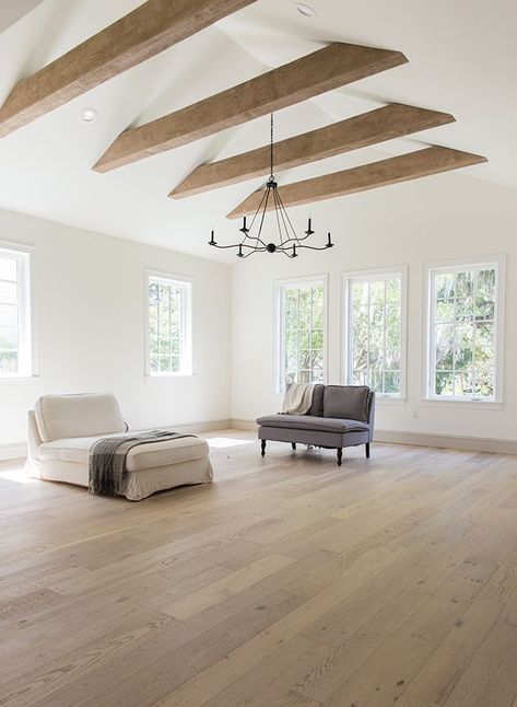 Expansive modern living room with vaulted ceiling and exposed beams. The flooring is wide white oak Heights House, Beams Living Room, Vaulted Ceiling Living Room, Exposed Beams, Wood Beams, Ceiling Beams, Wood Flooring, House Flooring, Ceiling Design