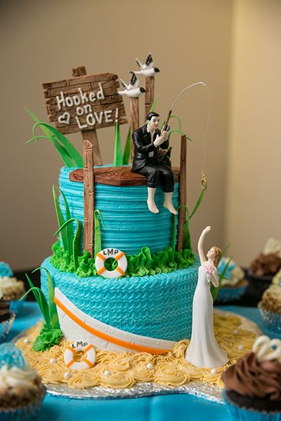 Build your theme around a favorite location or hobby, like this beach and fishing-themed celebration held near a marina with gorgeous sunset views. Rehearsal Dinner Fun, Fishing Wedding Cakes, Groomsman Cake, Fishing Themed Wedding, Wedding Themes Ideas, Grooms Table, Beach Cake, Fishing Wedding, Beach Cakes