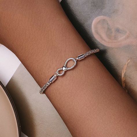 Buy S925 Sterling Silver Minimalist Infinite Loop Jewelry Women's Bracelet exclusively on www.shopperspointindia.com Experience the new design and superior quality of this must-have bracelet for fashion-forward women. With its stunning appearance, this bracelet is sure to impress. Don't miss out on this opportunity to elevate your style. Specifications include: chain lengths of 170mm and 190mm, wireless symbol measuring 8 * 18mm, and chain thickness of 3mm. This bracelet weighs approximately... Silver Bracelet For Women, Basic Bracelet, Silver Bracelets For Women, Bead Charms Diy, Charm Bangle, Chic Jewelry, Bracelet Collection, Love Bracelets, Bracelet For Women