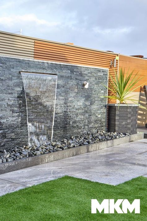 Make your garden a peaceful space with our Exilis walling water feature.This modern garden walling is easy to maintain with its natural stone split face surface. Pergola Water Feature, Slate Water Feature Wall, Water Feature Against Wall, Herbs Landscaping, Outdoor Feature Wall Ideas, Wall Waterfall Outdoor, Wall Waterfall, Garden Water Features, Waterfall Building