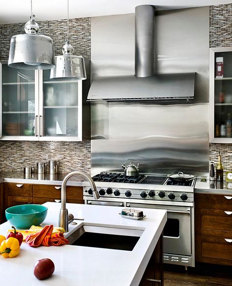 Stainless steel backsplash near the stove in a bright kitchen Stainless Steel Kitchen Backsplash, Kitchen Backsplash Inspiration, Stainless Steel Backsplash, Quartz Backsplash, Stove Backsplash, Steel Backsplash, Unique Backsplash, Metallic Backsplash, Backsplash Panels