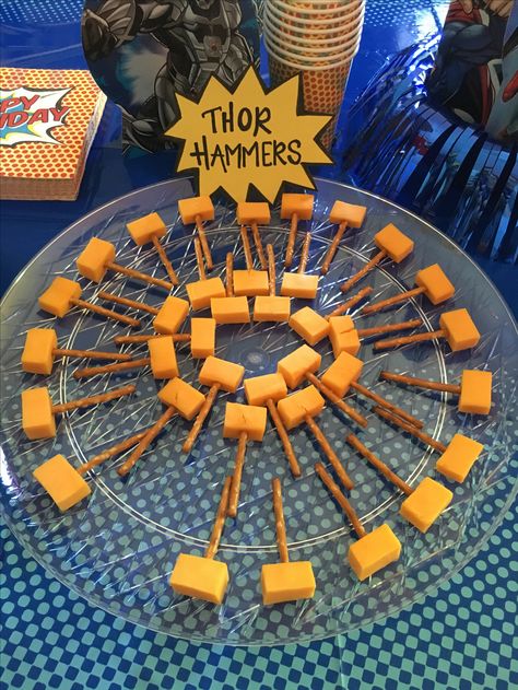 Thor hammer snacks! Avengers Birthday Party Food Ideas, Marvel Birthday Food Ideas, Marvel Avengers Party Food, Superhero Theme Snacks, Superhero Birthday Party Snacks, Avengers Pool Party Ideas, Superhero Birthday Party Food Ideas, Marvel Charcuterie Board, Avengers Party Snacks